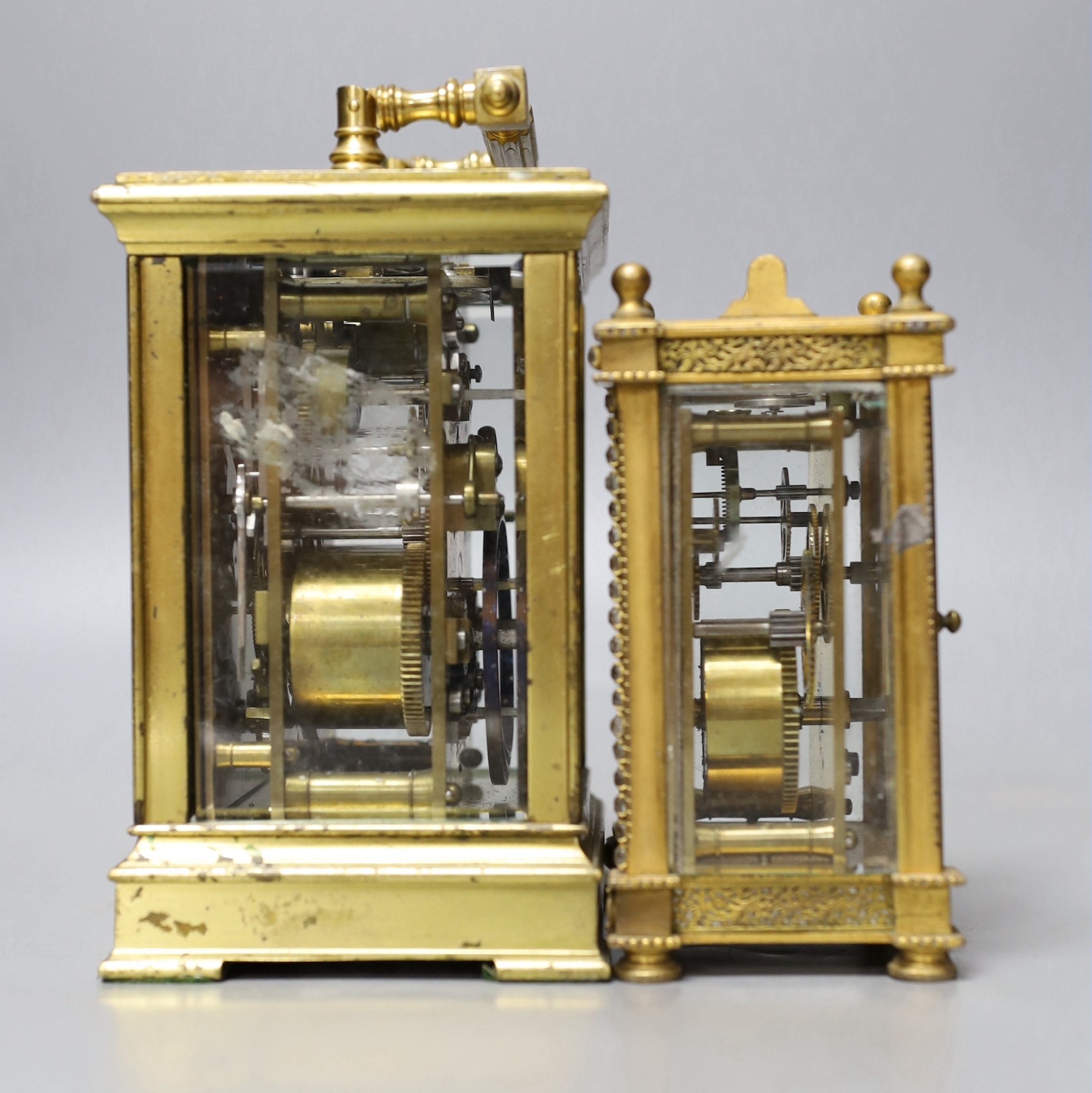 A large French repeating carriage clock with alarm, 16cm. High with handle down and a carriage timepiece